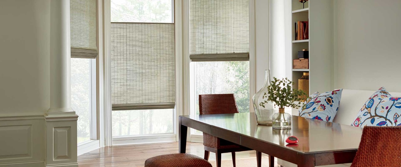 Dining room with Provenance® Woven Wood Shades.